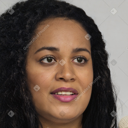 Joyful black young-adult female with long  brown hair and brown eyes