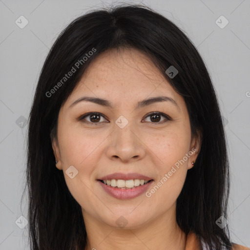 Joyful asian young-adult female with long  brown hair and brown eyes