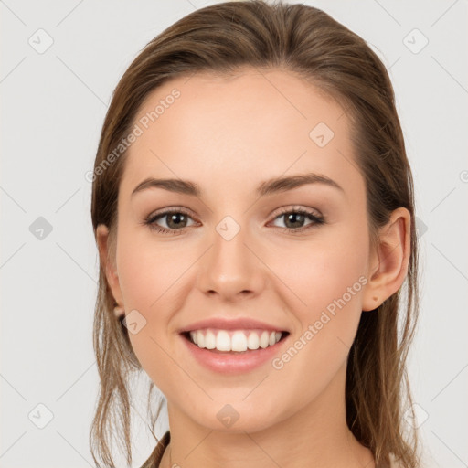 Joyful white young-adult female with long  brown hair and grey eyes