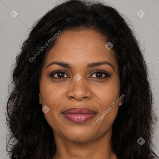 Joyful black young-adult female with long  brown hair and brown eyes