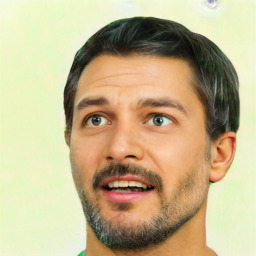 Joyful latino adult male with short  black hair and brown eyes