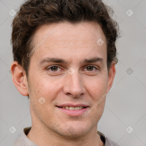 Joyful white adult male with short  brown hair and grey eyes