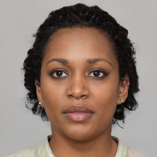 Neutral black young-adult female with short  black hair and brown eyes
