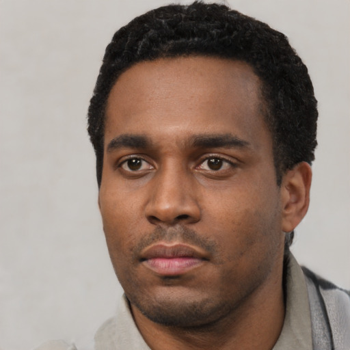 Neutral latino young-adult male with short  black hair and brown eyes