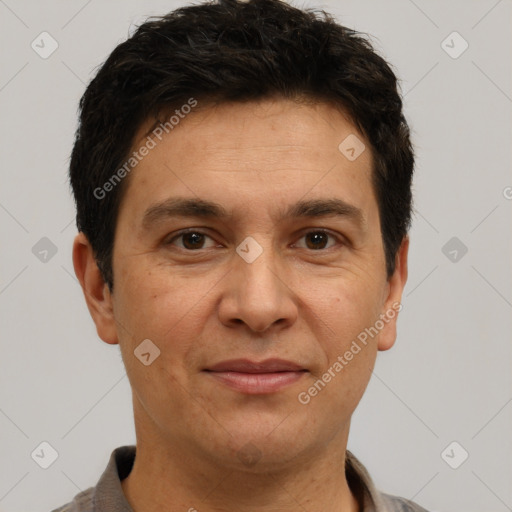 Joyful white adult male with short  brown hair and brown eyes