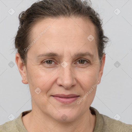 Joyful white adult female with short  brown hair and grey eyes