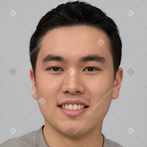 Joyful white young-adult male with short  black hair and brown eyes