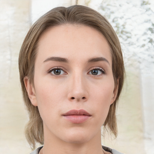 Neutral white young-adult female with medium  brown hair and grey eyes