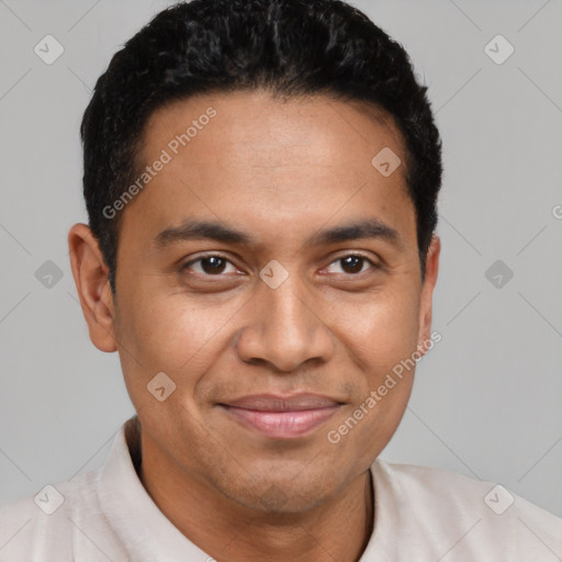 Joyful latino young-adult male with short  brown hair and brown eyes