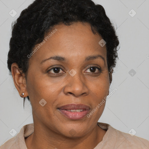 Joyful black adult female with short  brown hair and brown eyes