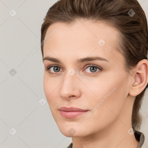 Neutral white young-adult female with long  brown hair and brown eyes