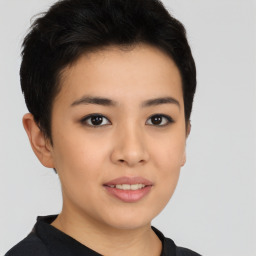 Joyful asian young-adult female with short  black hair and brown eyes