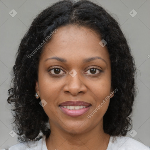 Joyful black young-adult female with medium  brown hair and brown eyes