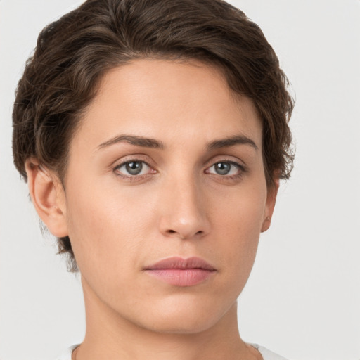 Neutral white young-adult female with short  brown hair and brown eyes