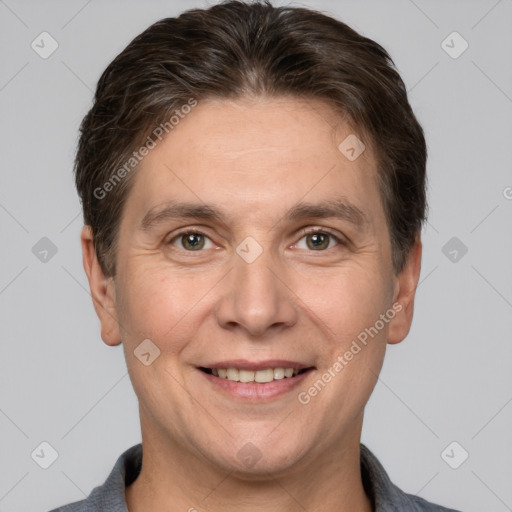 Joyful white adult male with short  brown hair and brown eyes