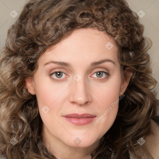 Joyful white young-adult female with medium  brown hair and green eyes