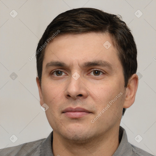 Neutral white young-adult male with short  brown hair and grey eyes