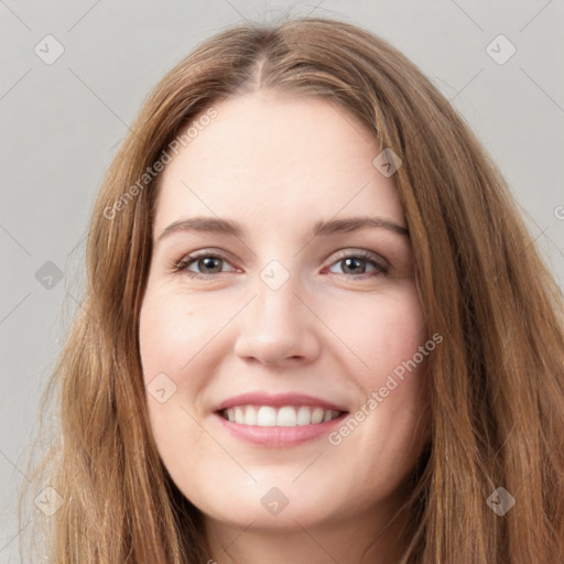 Joyful white young-adult female with long  brown hair and green eyes