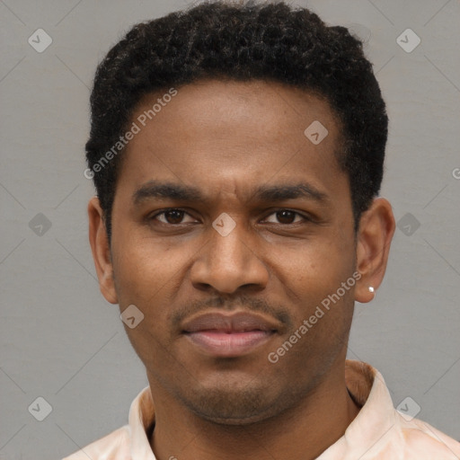 Joyful latino young-adult male with short  brown hair and brown eyes