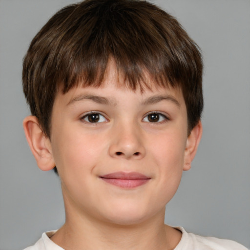 Joyful white child male with short  brown hair and brown eyes