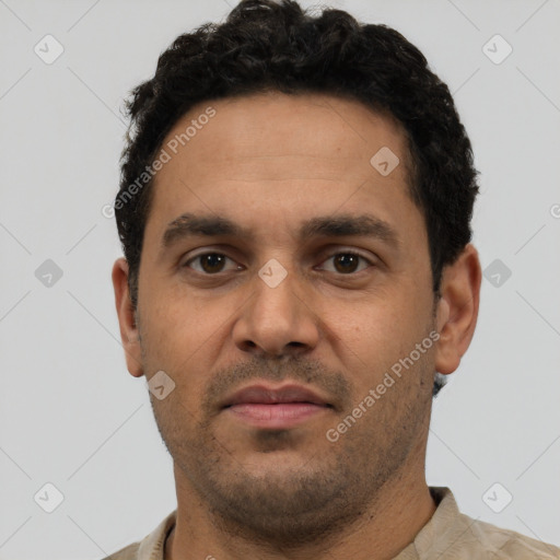 Neutral latino adult male with short  black hair and brown eyes