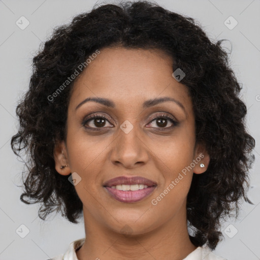 Joyful black young-adult female with medium  brown hair and brown eyes