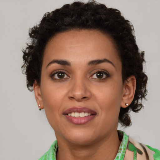 Joyful latino young-adult female with short  brown hair and brown eyes