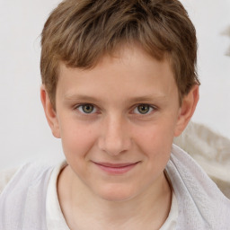 Joyful white child male with short  brown hair and brown eyes