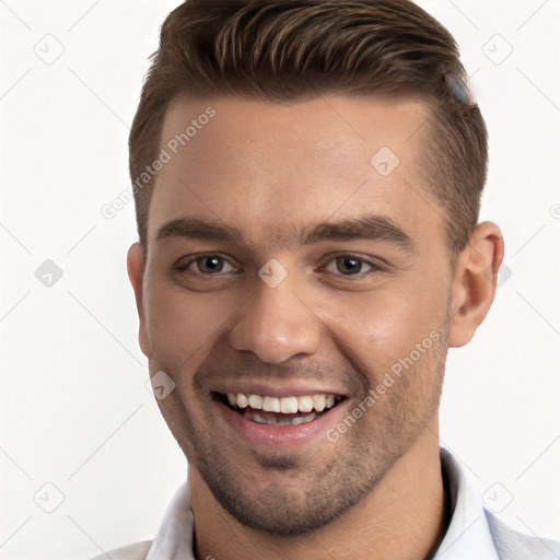 Joyful white young-adult male with short  brown hair and brown eyes