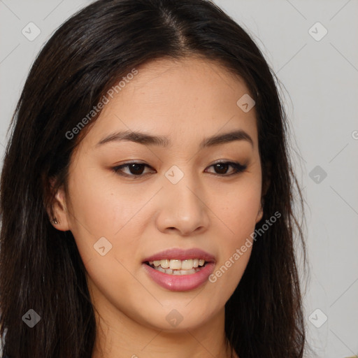 Joyful asian young-adult female with long  brown hair and brown eyes