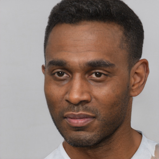 Neutral black young-adult male with short  black hair and brown eyes