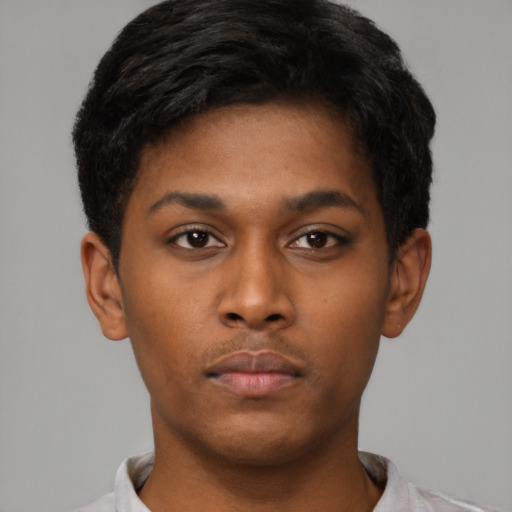 Neutral black young-adult male with short  brown hair and brown eyes