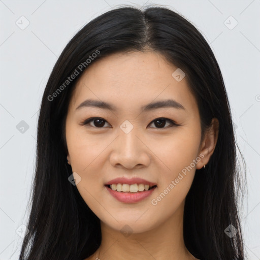 Joyful asian young-adult female with long  black hair and brown eyes