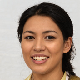 Joyful asian young-adult female with long  brown hair and brown eyes