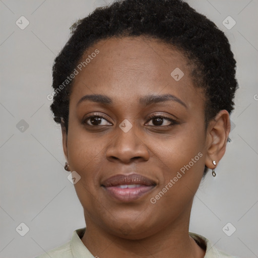 Joyful black young-adult female with short  brown hair and brown eyes