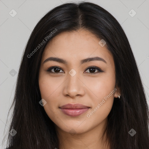 Joyful latino young-adult female with long  black hair and brown eyes