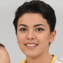 Joyful white young-adult female with short  brown hair and brown eyes