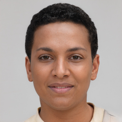 Joyful latino young-adult female with short  black hair and brown eyes