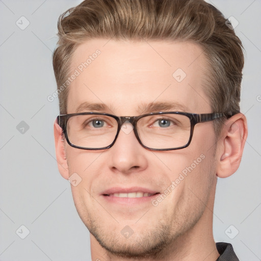 Joyful white adult male with short  brown hair and grey eyes