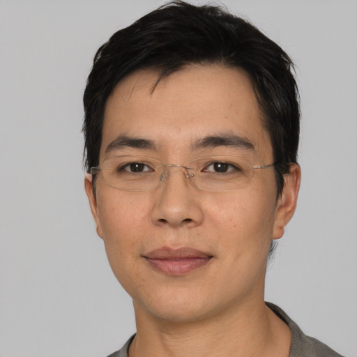 Neutral asian adult male with short  black hair and brown eyes
