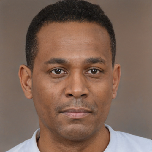 Neutral black young-adult male with short  black hair and brown eyes