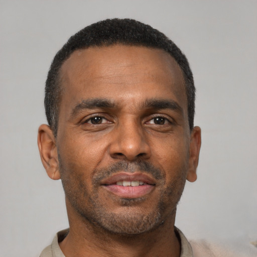 Neutral latino adult male with short  black hair and brown eyes