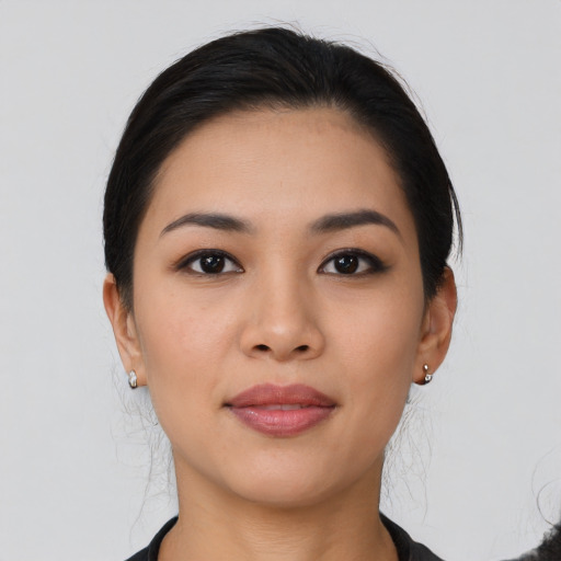Joyful asian young-adult female with medium  black hair and brown eyes