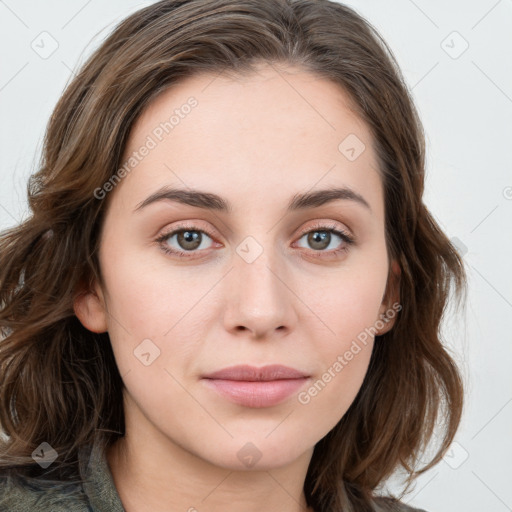 Joyful white young-adult female with long  brown hair and green eyes