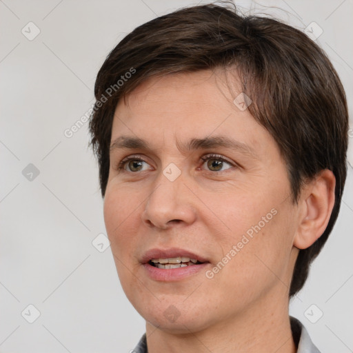 Joyful white adult female with short  brown hair and brown eyes