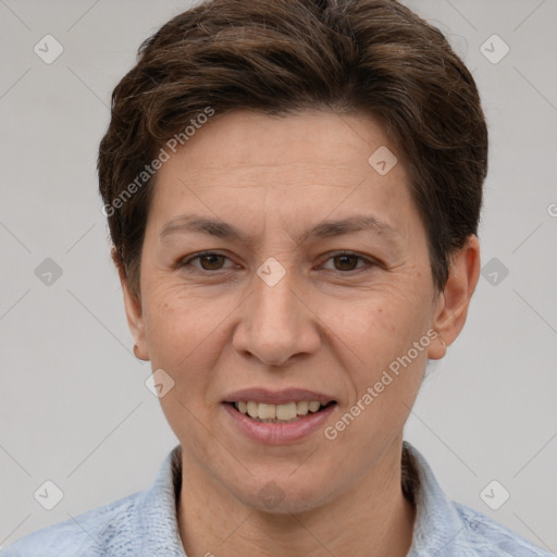 Joyful white adult female with short  brown hair and grey eyes