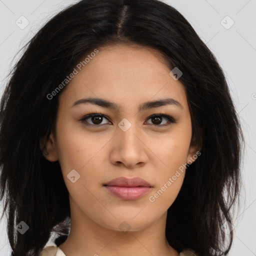 Joyful latino young-adult female with long  brown hair and brown eyes