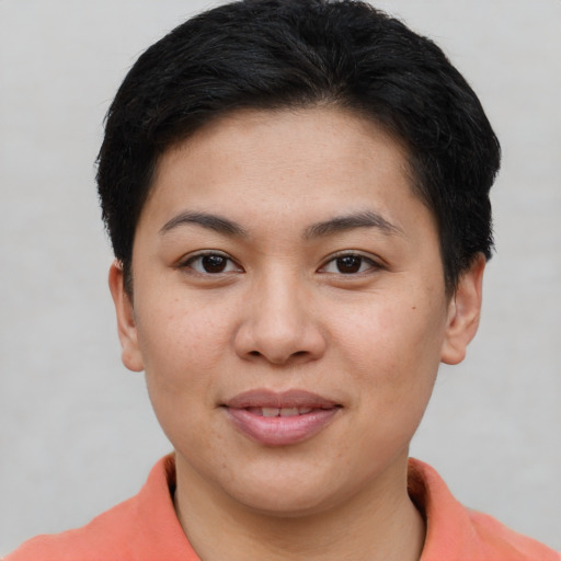 Joyful asian young-adult female with short  brown hair and brown eyes
