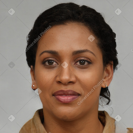 Joyful black adult female with short  brown hair and brown eyes