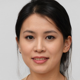 Joyful asian young-adult female with medium  brown hair and brown eyes